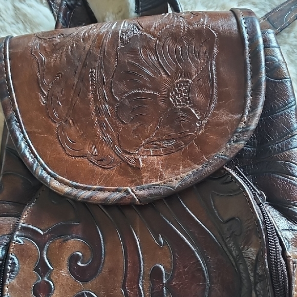 Elegant Brown Leather Backpack with Embossed Design - Picture 2 of 14